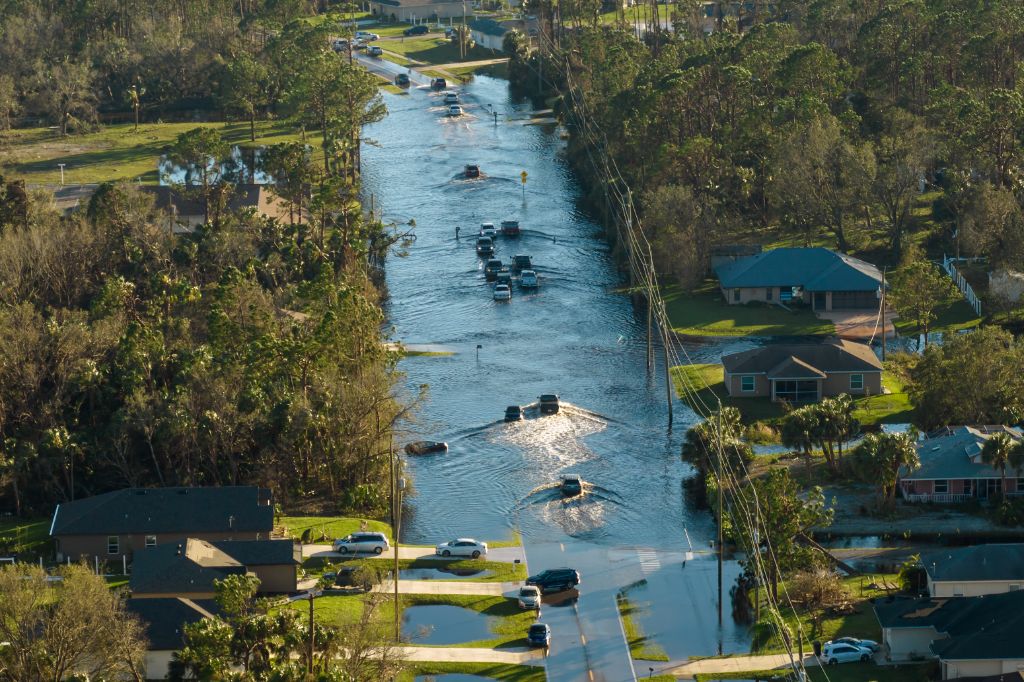 Aerial view of flooded Texas neighborhood street with submerged vehicles